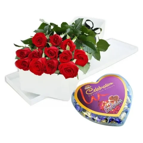 One dozen red roses in a box with chocolates in a heart shape box